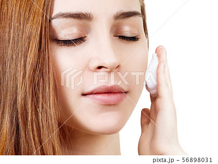 Young woman cleaning her face by napkins. 56898031