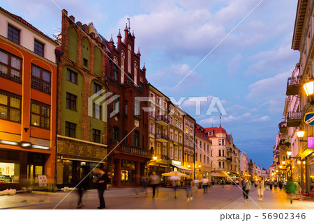 Night view of Torun streets and building illuminated at dusk 56902346