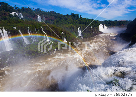 Rainbow over Cataratas del Iguazu waterfall, Brazil 56902378