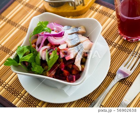 Fresh salad vinaigrette on a bamboo napkin. Russian dish Fresh salad vinaigrette on a bamboo napkin. Russian dish 56902638