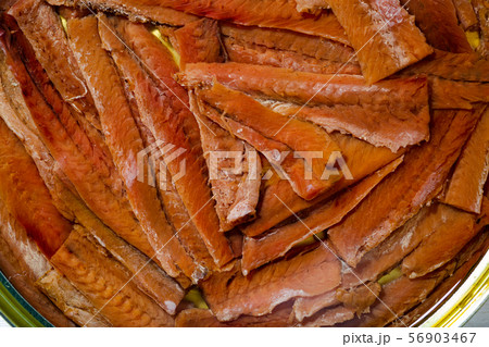 Closeup of tinned anchovy fillets in oil 56903467