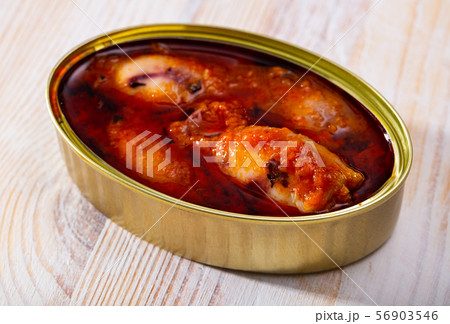 Image of canned stuffed squid in American sauce in open tin can Image of canned stuffed squid in American sauce in open tin can 56903546