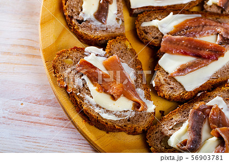 Bread with butter and salted anchovy fillets Bread with butter and salted anchovy fillets 56903781