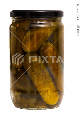 Glass jar with pickled cucumbers on white background Glass jar with pickled cucumbers on white background 56904419