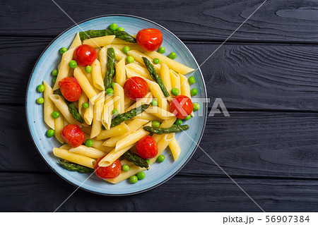 Penne pasta salad with asparagus , tomatoes and Penne pasta salad with asparagus , tomatoes and 56907384