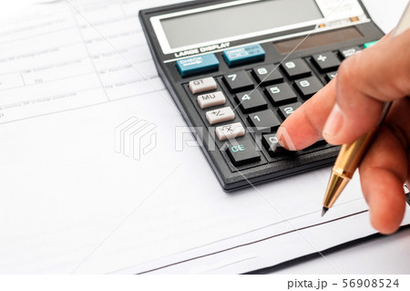calculator and documents for working on the table, calculator and documents for working on the table, 56908524