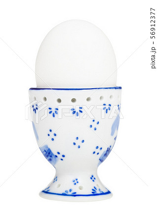 white boiled egg in egg cup with a blunt end up 56912377