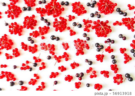 Pattern from fresh red and black berries isolated on white background. 56913918