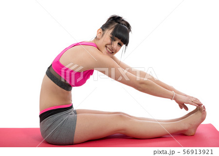 smiling young woman girl doing exercise on floor smiling young woman girl doing exercise on floor 56913921