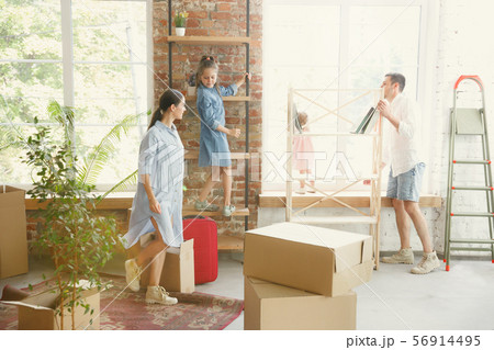 Adult family moved to a new house or apartment Adult family moved to a new house or apartment 56914495