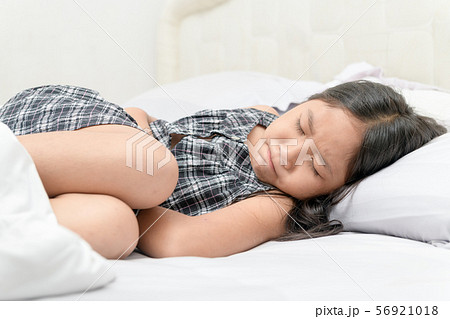 asian child suffering from stomachache 56921018