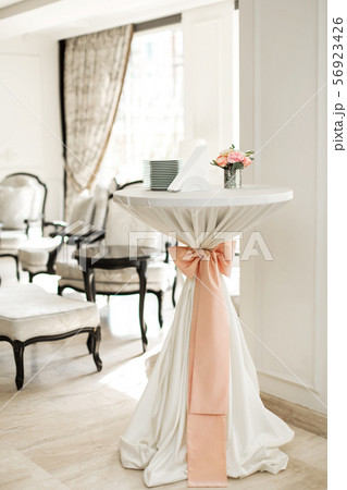 A small auxiliary table in the restaurant, on 56923426