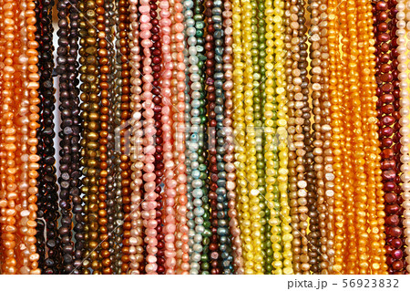 String of colorful bead necklace on retail display 56923832