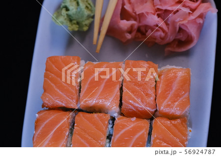 Sushi roll with seafood and soy sauce, wasabi and 56924787