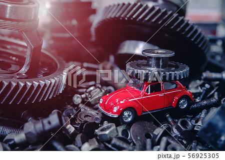 red car on the background of old spare parts red car on the background of old spare parts 56925305