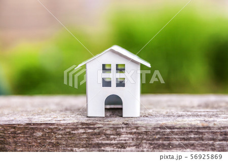 Miniature white toy model house in wooden Miniature white toy model house in wooden 56925869
