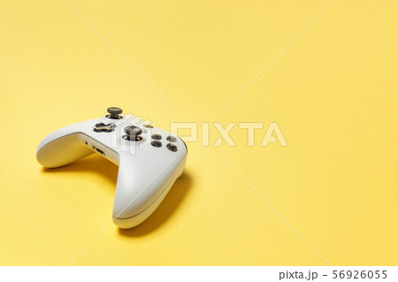 White joystick on yellow background. Computer White joystick on yellow background. Computer 56926055