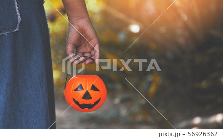 Halloween pumpkin lantern on hand / head jack o Halloween pumpkin lantern on hand / head jack o 56926362