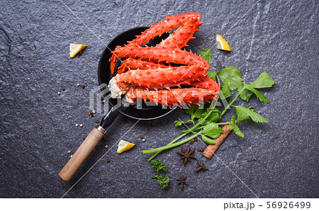 Crab Legs in pot on dark background - Alaskan King 56926499