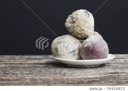 three peaches with mold 56926823