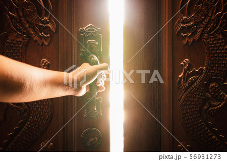 Hand open door light concept 56931273