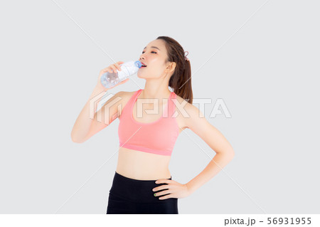 Beautiful asian woman fit shape drinking water 56931955
