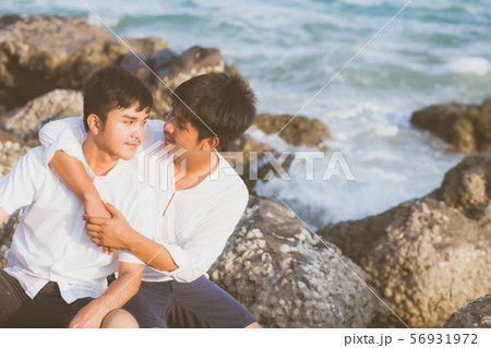 Homosexual portrait young asian couple sitting hug 56931972