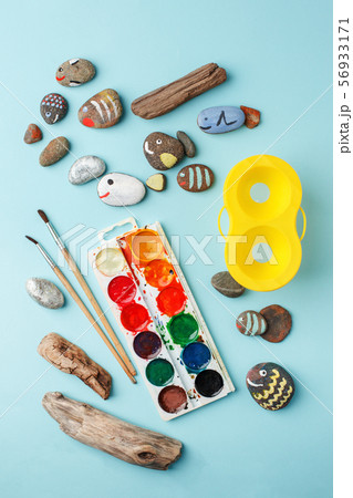 Hand-painted colorful stones and watercolor paint 56933171