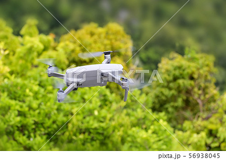 Drones while flying up from the floor with trees Drones while flying up from the floor with trees 56938045