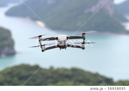 Drones while flying in the sky, Ocean and island Drones while flying in the sky, Ocean and island 56938095