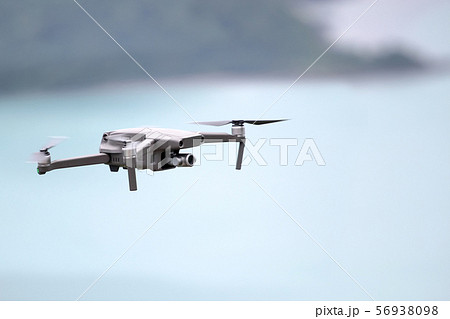 Drones while flying in the sky, Ocean and island Drones while flying in the sky, Ocean and island 56938098