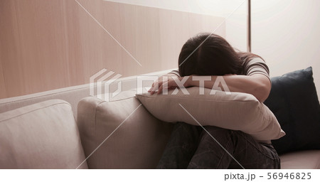 woman feel depressed on sofa woman feel depressed on sofa 56946825
