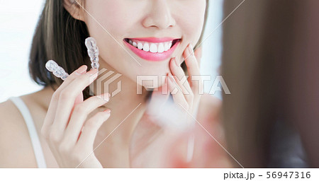 woman take off invisible braces woman take off invisible braces 56947316