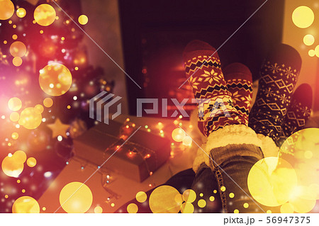 woolen socks near fireplace 56947375