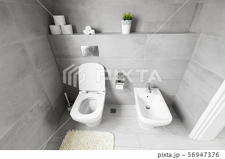 White ceramic bidet and toilet at luxury bathroom 56947376