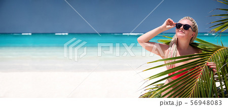 Woman with african braids in pink bikini on Woman with african braids in pink bikini on 56948083