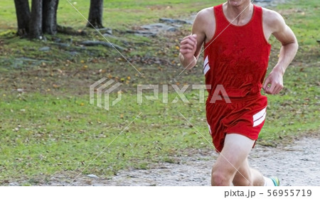 High school cross country runner in red uniform High school cross country runner in red uniform 56955719