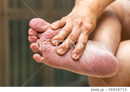 Senior woman's hands massaging her foot, About massage concept, Close up shot 56956713