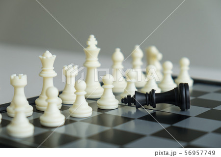 Chess pieces on board with white background, Chess pieces on board with white background, 56957749