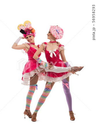 Playful women in original hats and dresses view Playful women in original hats and dresses view 56958293