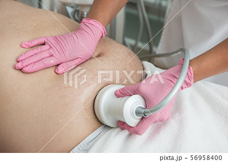 Belly cavitation at modern beauty clinic Belly cavitation at modern beauty clinic 56958400