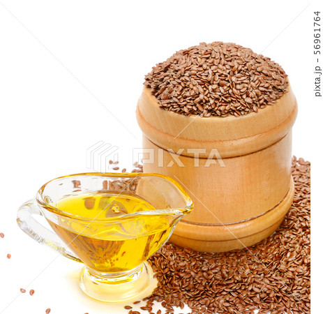 Flax seeds and oil isolated on white background. Flax seeds and oil isolated on white background. 56961764