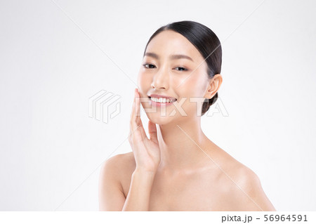 Beautiful Asian woman touching soft cheek smile with clean and fresh skin Happiness and cheerful with positive emotional,isolated on white background,Beauty and Cosmetics Concept 56964591
