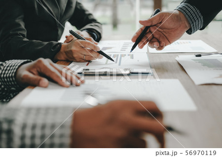 financial adviser discussing with investor. business people have a meeting. businessman working with team financial adviser discussing with investor. business people have a meeting. businessman working with team 56970119