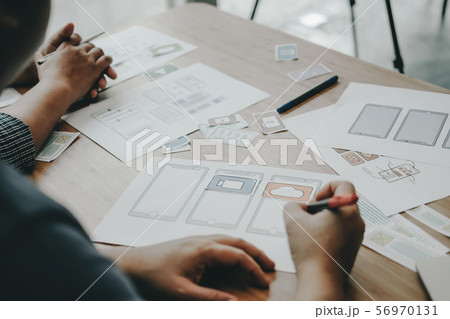 user experience UX designer designing web on smart phone layout. UI developer planning working on mobile application prototype user experience UX designer designing web on smart phone layout. UI developer planning working on mobile application prototype 56970131