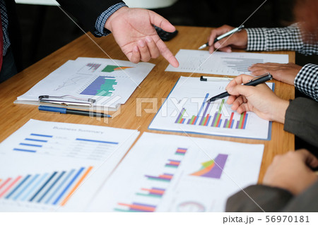 financial adviser discussing with investor. business people have a meeting. businessman working with team financial adviser discussing with investor. business people have a meeting. businessman working with team 56970181