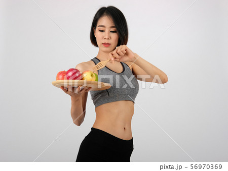 sporty fitness woman in sportswear with apple. healthy sport lifestyle sporty fitness woman in sportswear with apple. healthy sport lifestyle 56970369