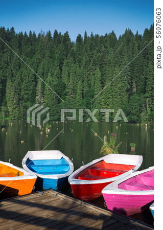 bright boats on a mountain lake 56976063