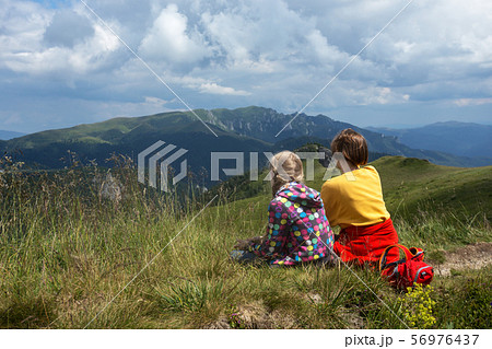 tourist girls relax in the mountains tourist girls relax in the mountains 56976437