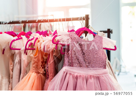 Rack with many beautiful holiday dresses for girls 56977055